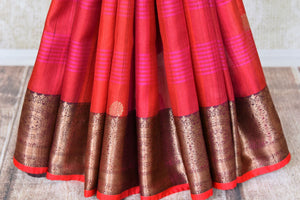 Buy beautiful pink stripes red tussar Banarasi saree online in USA with zari border and pallu. Take your ethnic style  to next level with exquisite Banarasi saris from Pure Elegance Indian fashion store in USA. Shop online.-pleats