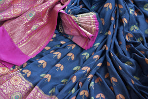 Shop navy blue muga Banarasi sari online in USA with flower minakari zari buta. Radiate traditional charm with beautiful Banarasi sarees from Pure Elegance Indian clothing store in USA. Choose from a variety of Banarasi silk sarees, Banarasi georgette sarees, Banarasi tussar saris for special occasions.-details