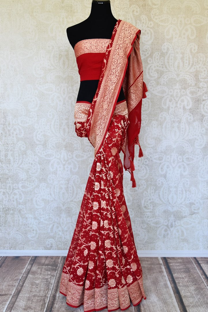 Buy traditional red georgette Banarasi sari online in USA with zari work. Feel traditional on special occasions in beautiful Indian designer saris from Pure Elegance Indian fashion store in USA. Choose from a splendid variety of Banarasi sarees, pure handwoven saris. Buy online.-full view