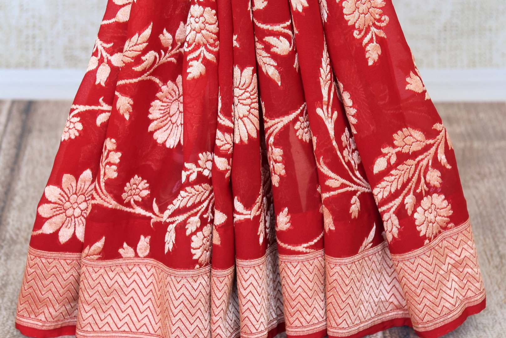 Shop traditional red georgette Banarasi saree online in USA with foliate zari work. Feel traditional on special occasions in beautiful Indian designer saris from Pure Elegance Indian fashion store in USA. Choose from a splendid variety of Banarasi sarees, pure handwoven saris. Buy online.-pleats