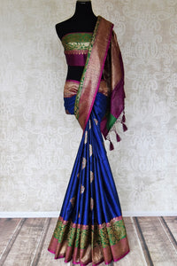 Buy blue striped tussar Benarasi saree online in USA with zari buta and purple and green antique zari border. Shine bright in best of Indian designer sarees from Pure Elegance Indian fashion store in USA on special occasions. Choose from a splendid variety of Banarasi sarees, pure handwoven saris. Shop online.-full view
