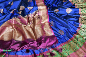Buy blue striped tussar Benarasi saree online in USA with zari buta and purple and green antique zari border. Shine bright in best of Indian designer sarees from Pure Elegance Indian fashion store in USA on special occasions. Choose from a splendid variety of Banarasi sarees, pure handwoven saris. Shop online.-details
