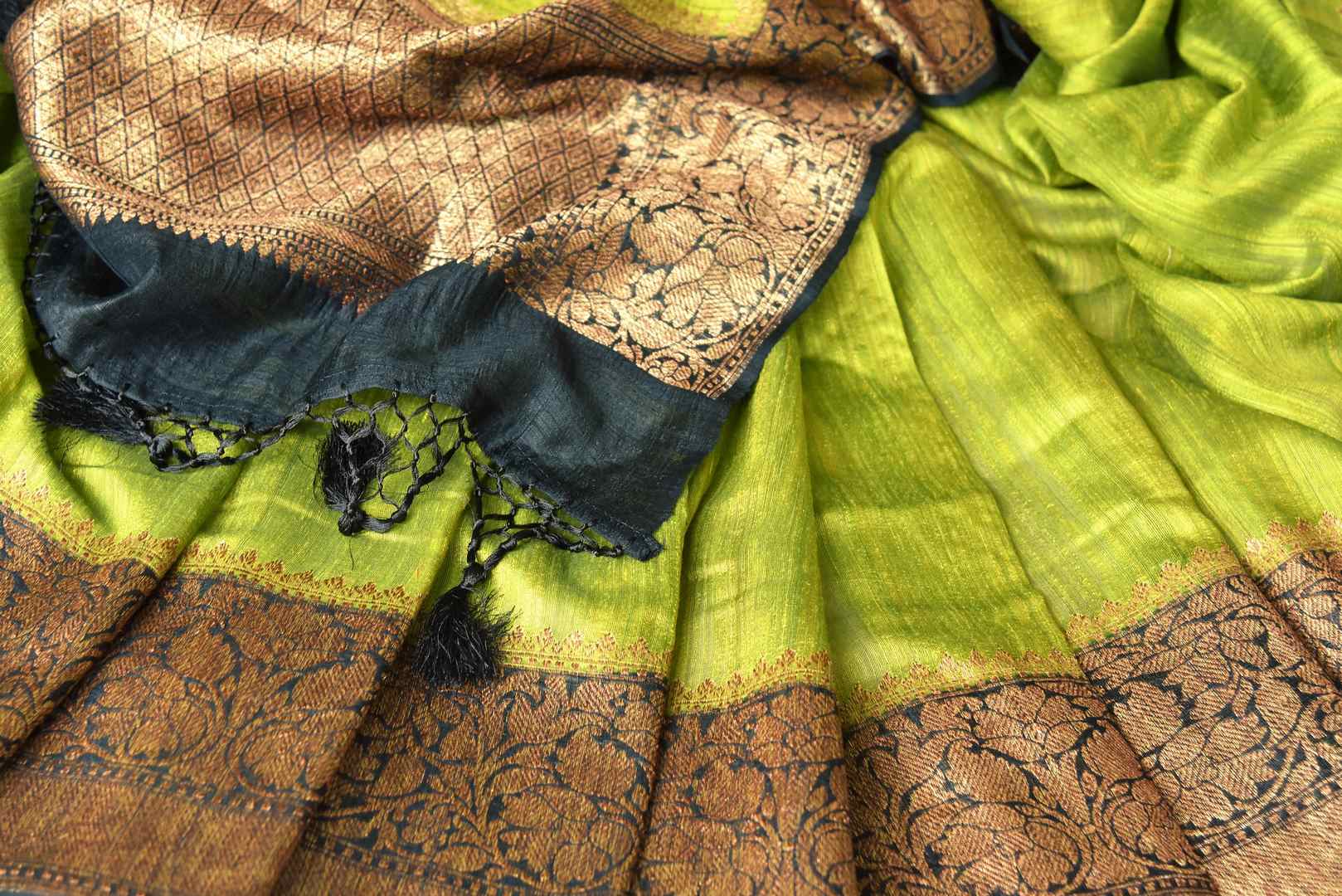 Buy lime green color tussar Benarasi saree online in USA with black zari border. Be an epitome of elegance in exquisite Banarasi saris from Pure Elegance Indian clothing store in USA.-details