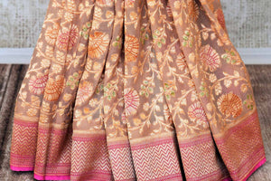 Shop beige georgette Banarasi saree online in USA with zari minakari floral jaal. Feel traditional on special occasions in beautiful Indian designer saris from Pure Elegance Indian fashion store in USA. Choose from a splendid variety of Banarasi sarees, pure handwoven saris. Buy online.-pleats