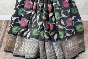 Shop dark grey khaddi Banarasi saree online in USA with zari floral work. Feel traditional on special occasions in beautiful Indian designer saris from Pure Elegance Indian fashion store in USA. Choose from a splendid variety of Banarasi sarees, pure handwoven saris. Buy online.-pleats