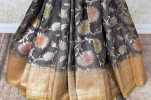 Buy grey khaddi Banarasi sari online in USA with minakari zari floral work. Feel traditional on special occasions in beautiful Indian designer sarees from Pure Elegance Indian fashion store in USA. Choose from a splendid variety of Banarasi sarees, pure handwoven saris. Buy online.-pleats