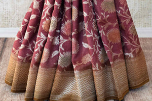 Buy wine color khaddi Benarasi saree online in USA with brown zari border. Feel traditional on special occasions in beautiful Indian designer sarees from Pure Elegance Indian fashion store in USA. Choose from a splendid variety of Banarasi sarees, pure handwoven saris. Buy online.-pleats
