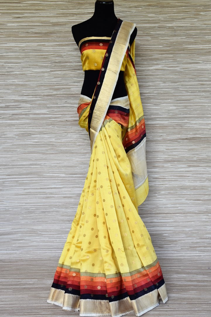 Shop bright yellow zari buta muga silk sari online in USA with multicolor zari border. Stand amongst the crowd with your tasteful ethnic style in beautiful handwoven silk sarees from Pure Elegance Indian fashion store for Indian women in USA.-full view
