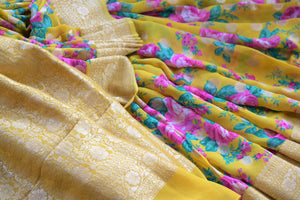 Buy bright yellow floral georgette Banarasi sari online in USA with zari border. Radiate traditional charm with beautiful Banarasi sarees from Pure Elegance Indian clothing store in USA. Choose from a variety of Banarasi silk sarees, Banarasi georgette sarees, Banarasi tussar saris for special occasions.-details