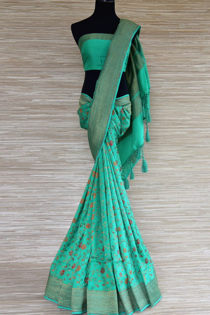 Buy green muga Benarasi sari online in USA with floral minakari zari design. Radiate traditional charm with beautiful Banarasi sarees from Pure Elegance Indian clothing store in USA. Choose from a variety of Banarasi silk sarees, Banarasi georgette sarees, Banarasi tussar saris for special occasions.-full view