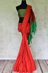 Buy red borderless muga Banarasi sari online in USA with zari minakari buta and green pallu. Be an epitome of elegance in exquisite Banarasi saris from Pure Elegance Indian clothing store in USA.-full view