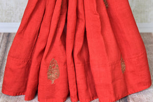 Buy red borderless muga Banarasi sari online in USA with zari minakari buta and green pallu. Be an epitome of elegance in exquisite Banarasi saris from Pure Elegance Indian clothing store in USA.-pleats
