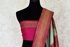 Buy stunning mint green muga Banarasi sari online in USA with pink minakari antique zari border and pallu. Be an epitome of elegance in exquisite Banarasi saris from Pure Elegance Indian clothing store in USA.-blouse pallu