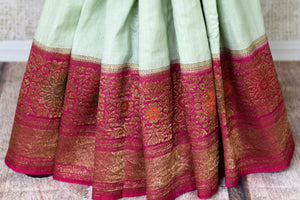 Buy stunning mint green muga Banarasi sari online in USA with pink minakari antique zari border and pallu. Be an epitome of elegance in exquisite Banarasi saris from Pure Elegance Indian clothing store in USA.-pleats