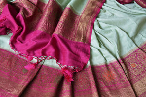 Buy stunning mint green muga Banarasi sari online in USA with pink minakari antique zari border and pallu. Be an epitome of elegance in exquisite Banarasi saris from Pure Elegance Indian clothing store in USA.-details