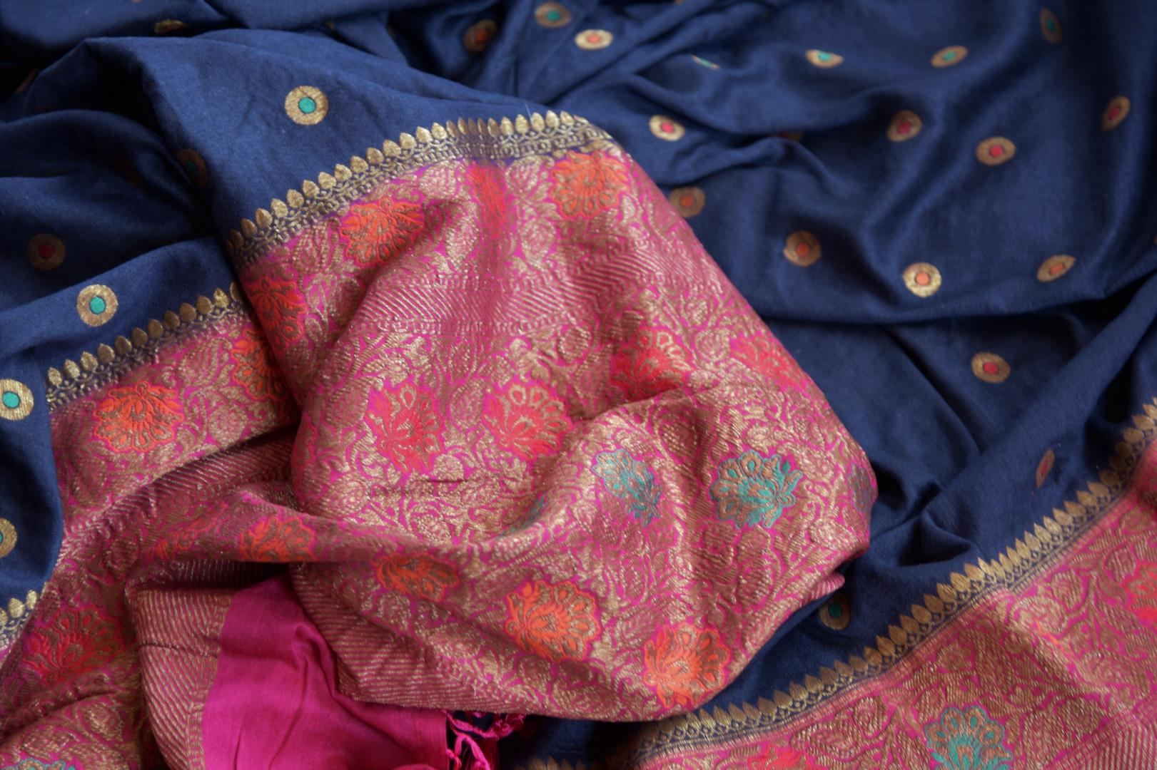 Buy dark blue muga Banarasi saree online in USA with pink minakari zari border. Radiate traditional charm with beautiful Banarasi sarees from Pure Elegance Indian clothing store in USA. Choose from a variety of Banarasi silk sarees, Banarasi georgette sarees, Banarasi tussar saris for special occasions.-details