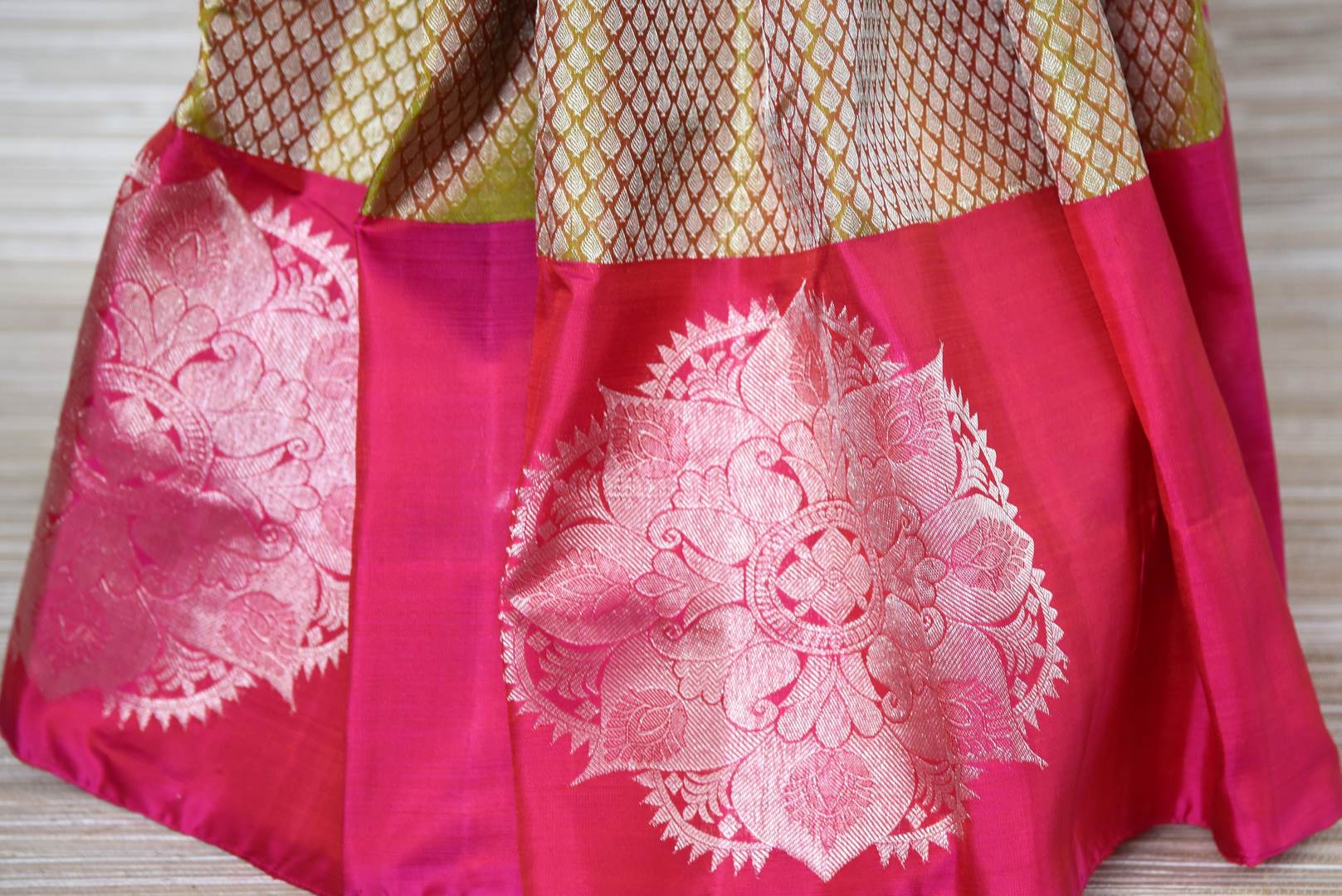 Buy green zari buta Kanjeevaram sari online in USA with pink zari buta border. Update your saree wardrobe with latest designs in Kanjeevaram silk sarees from Pure Elegance Indian clothing in USA. Shop online now.-pleats