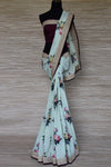 Buy mint green floral tussar georgette sari online in USA with embroidered border. Update your saree wardrobe this festive season with latest designer sarees. soft silk sarees, handwoven saris from Pure Elegance women's Indian clothing store in USA. Shop online  now.-full view