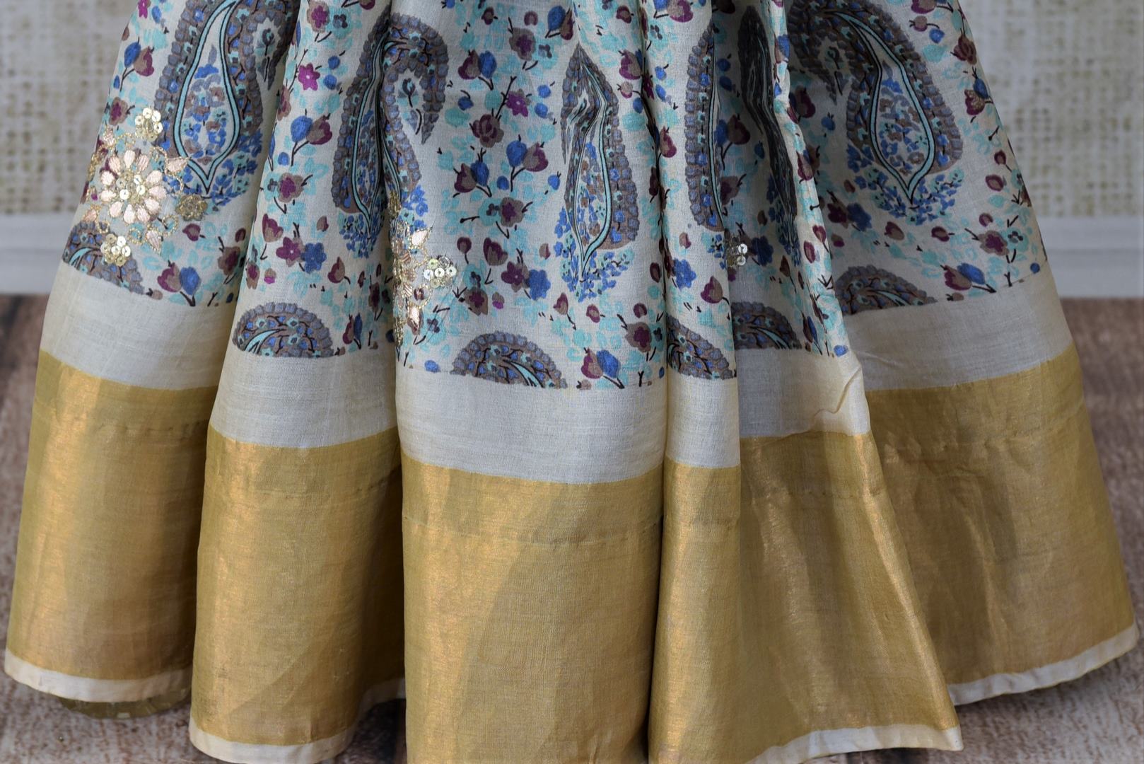 Buy gorgeous cream gota work printed tussar saree online in USA with golden border. Set high fashion standards with your exceptional choice of handwoven sarees, soft silk sarees from Pure Elegance Indian fashion store in USA.-pleats