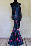 Buy navy blue crepe silk saree online in USA with pink floral print. Be the center of attraction at parties and weddings with exquisite designer saris, print sarees, Bollywood sarees from Pure Elegance Indian fashion store in USA.-full view