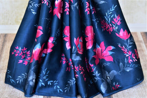 Buy navy blue crepe silk saree online in USA with pink floral print. Be the center of attraction at parties and weddings with exquisite designer saris, print sarees, Bollywood sarees from Pure Elegance Indian fashion store in USA.-pleats