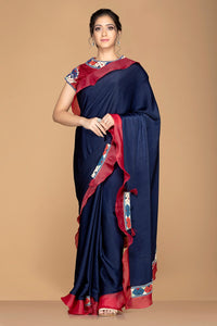 Buy gorgeous navy blue embroidered saree online in USA with maroon ruffle border and saree blouse. Elevate your sartorial choice with exclusive Indian designer sarees with blouse, embroidered sarees, pure silk sarees from Pure Elegance Indian fashion store in USA.-full view