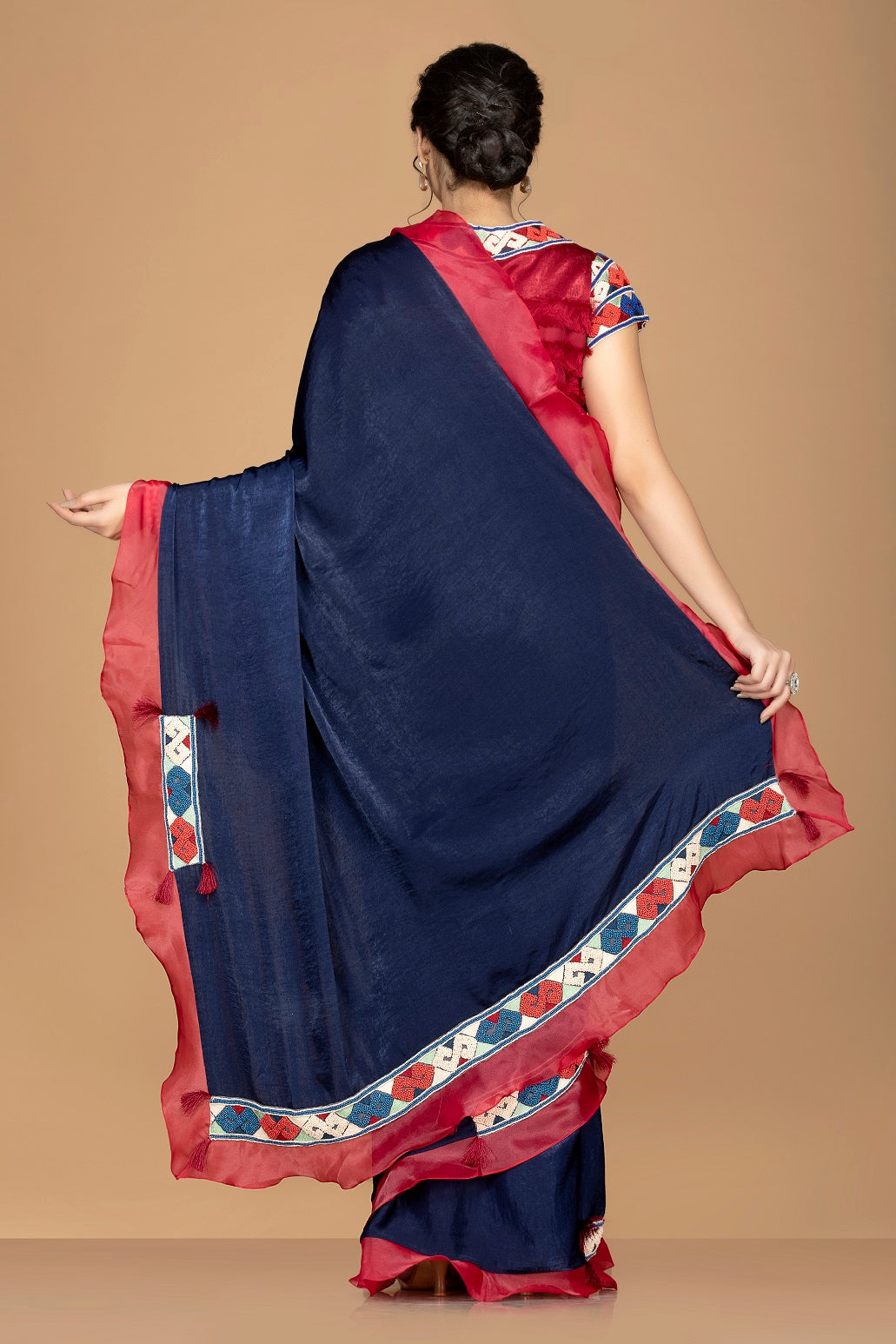 Buy gorgeous navy blue embroidered saree online in USA with maroon ruffle border and saree blouse. Elevate your sartorial choice with exclusive Indian designer sarees with blouse, embroidered sarees, pure silk sarees from Pure Elegance Indian fashion store in USA.-back