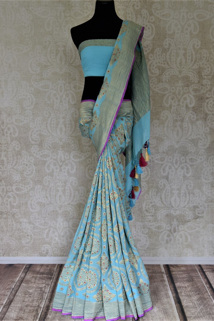 Shop stunning sky blue floral minakari and zari work georgette Banarasi saree online in USA. Go for an extraordinary traditional look with splendid handwoven sarees, embroidered sarees with blouses, Banarasi saris from Pure Elegance from Indian cloth store in USA.  Shop online or visit our store now.-full view