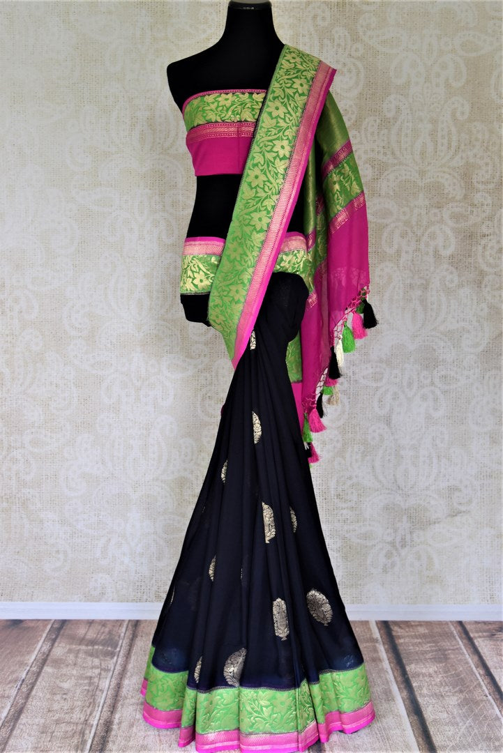 Shop gorgeous black organza Banarasi sari online in USA with green foliate zari border and zari buta. Make your saree wardrobe rich and colorful with stunning handwoven sarees, pure silk sarees, designer sarees from Pure Elegance Indian clothing store in USA.-full view