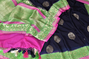 Shop gorgeous black organza Banarasi sari online in USA with green foliate zari border and zari buta. Make your saree wardrobe rich and colorful with stunning handwoven sarees, pure silk sarees, designer sarees from Pure Elegance Indian clothing store in USA.-details