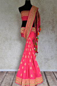 Buy bright pink paisley zari buta georgette Banarasi sari online in USA. Go for an extraordinary traditional look with splendid handwoven sarees, embroidered sarees with blouses, Banarasi saris from Pure Elegance from Indian cloth store in USA.  Shop online or visit our store now.-full view