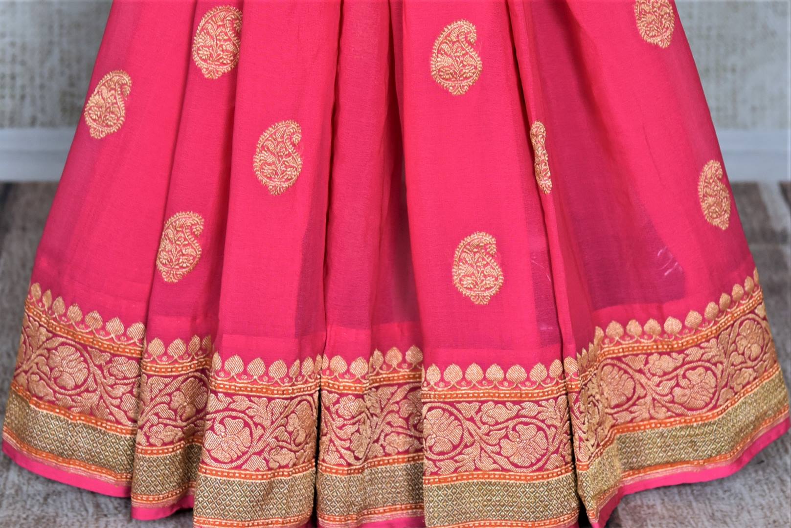 Buy bright pink paisley zari buta georgette Banarasi sari online in USA. Go for an extraordinary traditional look with splendid handwoven sarees, embroidered sarees with blouses, Banarasi saris from Pure Elegance from Indian cloth store in USA.  Shop online or visit our store now.-pleats