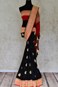 Buy captivating black floral zari buta georgette Banarasi saree online in USA. Go for an extraordinary traditional look with splendid handwoven sarees, embroidered sarees with blouses, Banarasi saris from Pure Elegance from Indian cloth store in USA.  Shop online or visit our store now.-full view
