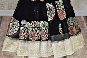 Shop gorgeous black big floral zari buta georgette Banarasi sari online in USA. Go for an extraordinary traditional look with splendid handwoven sarees, embroidered sarees with blouses, Banarasi saris from Pure Elegance from Indian cloth store in USA.  Shop online or visit our store now.-pleats