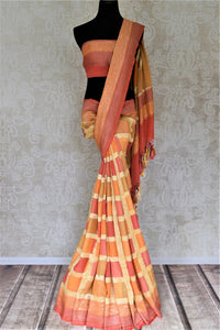 Buy lovely orange and pink zari check georgette Banarasi sari online in USA. Go for an extraordinary traditional look with splendid handwoven sarees, embroidered sarees with blouses, Banarasi saris from Pure Elegance from Indian cloth store in USA.  Shop online or visit our store now.-full view