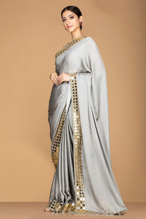 Buy online light grey saree online in USA with embroidered border and sari blouse. Champion ethnic fashion with a splendid collection of designer sarees, embroidered sarees with blouse, weddings sarees from Pure Elegance Indian fashion store in USA.-side