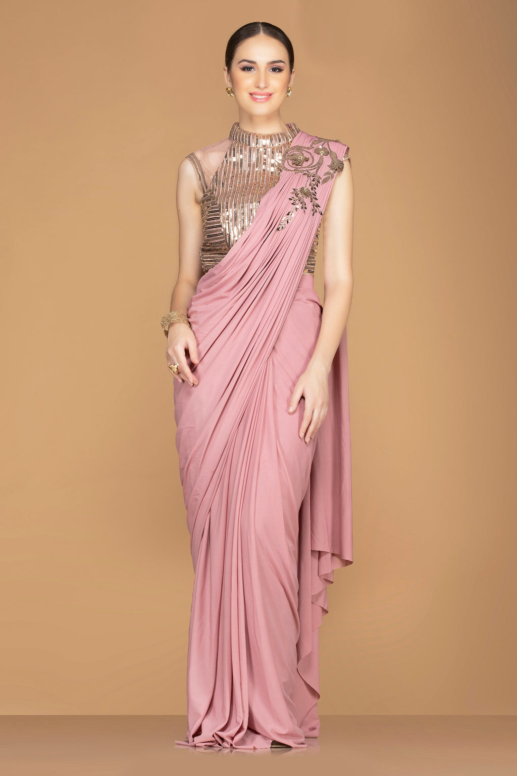 Buy beautiful rose pink draped pallu sari online in USA with designer sari blouse. Champion ethnic fashion with a splendid collection of designer sarees, embroidered sarees with blouse, weddings sarees from Pure Elegance Indian fashion store in USA.-full view