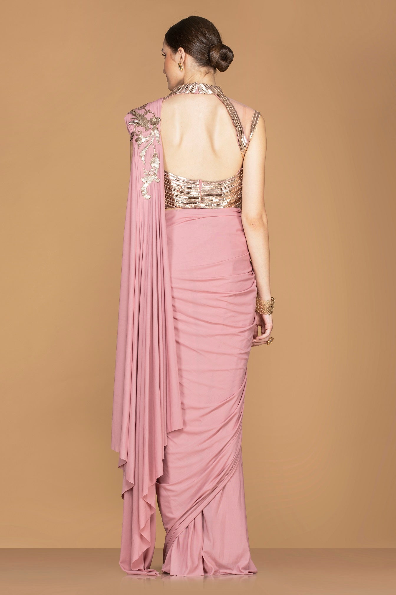 Buy beautiful rose pink draped pallu sari online in USA with designer sari blouse. Champion ethnic fashion with a splendid collection of designer sarees, embroidered sarees with blouse, weddings sarees from Pure Elegance Indian fashion store in USA.-back