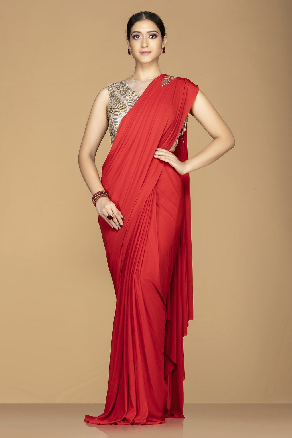 Shop gorgeous red embroidered designer saree online in USA with embroidered saree blouse. Champion ethnic fashion with a splendid collection of designer sarees, embroidered sarees with blouse, weddings saris from Pure Elegance Indian fashion store in USA.-full view