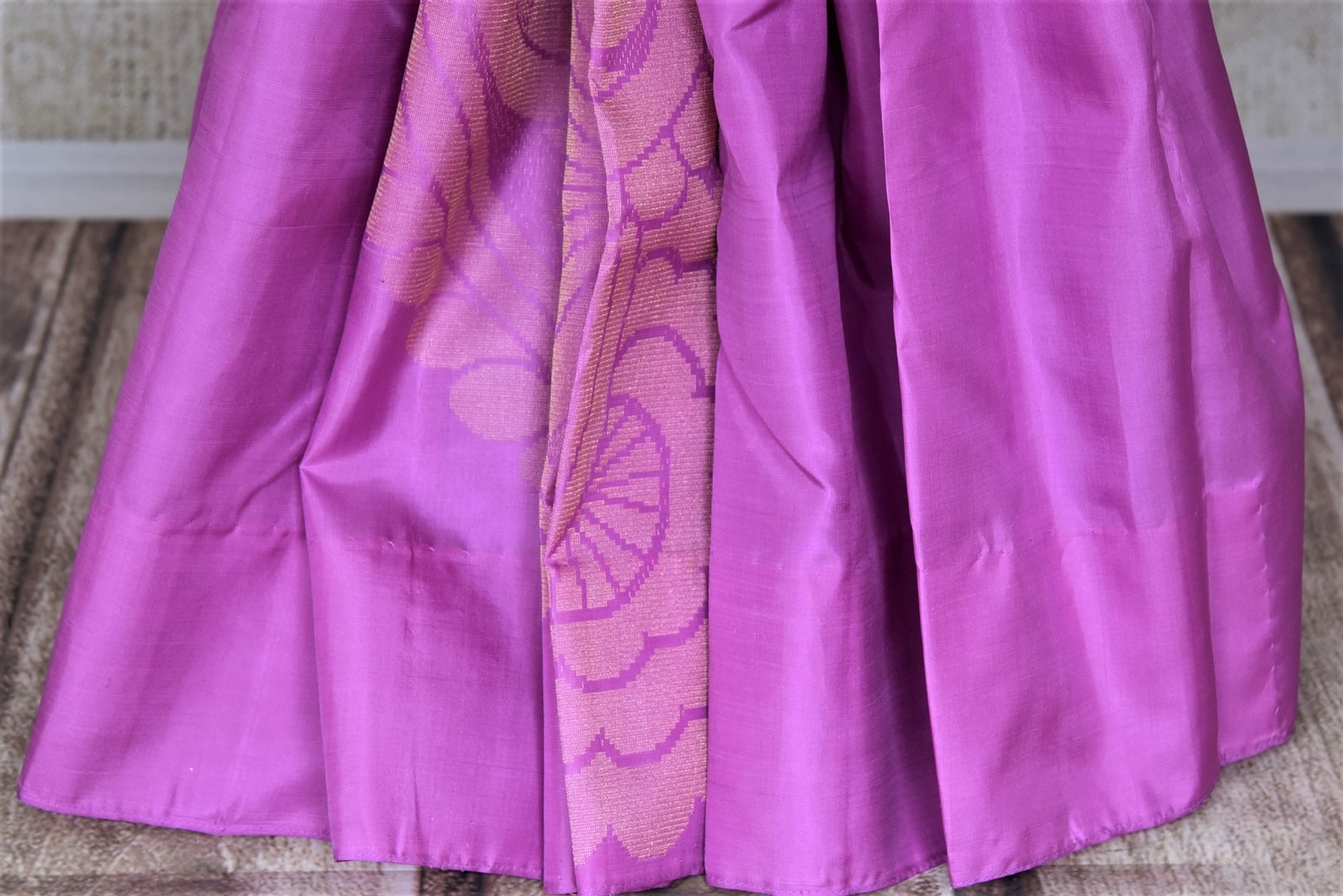 Shop stunning violet Kanchipuram sari online in USA with golden zari floral motifs. Add spark to your festive style with beautiful Kanchipuram silk saris in USA from Pure Elegance Indian fashion store.-pleats