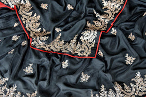 Shop stunning black silk saree online in USA with embroidered border. Be the center of attraction at weddings and parties with beautiful silk sarees, embroidered sarees, partywear sarees, fancy sarees from Pure Elegance Indian fashion store in USA. -details