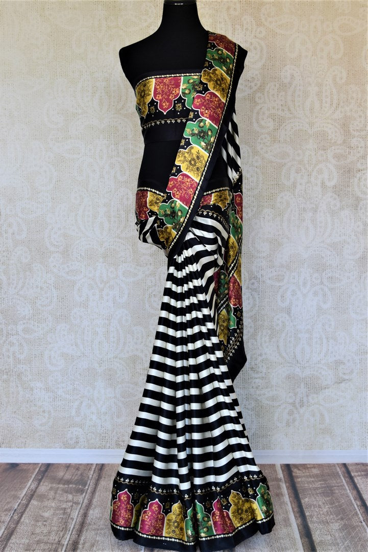 Buy elegant black and white striped crepe silk saree online in USA with printed border. Be the talk of the occasions in exquisite printed sarees, embroidered saris from Pure Elegance Indian fashion store in USA. -full view