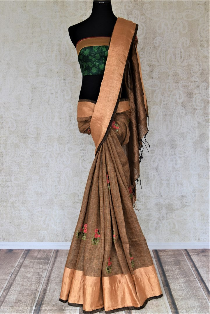 Buy gorgeous brown linen saree online in USA with embroidered floral motifs and zari border. Be the talk of the occasions in exquisite linen sarees, handwoven silk saris from Pure Elegance Indian fashion store in USA. -full view