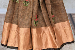 Buy gorgeous brown linen saree online in USA with embroidered floral motifs and zari border. Be the talk of the occasions in exquisite linen sarees, handwoven silk saris from Pure Elegance Indian fashion store in USA. -pleats