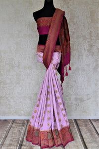 Shop lavender muga Banarasi saree online in USA with magenta antique zari floral border. Keep your ethnic style updated with latest designer sarees, handloom sarees, pure silk sarees from Pure Elegance Indian fashion store in USA.-full view