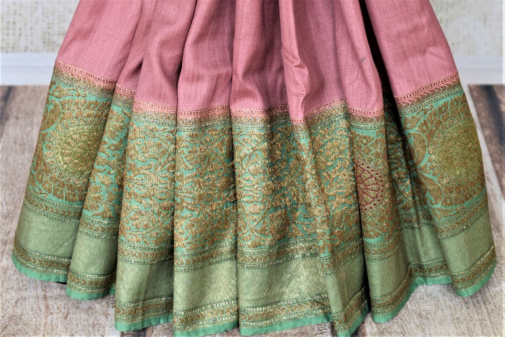 Shop beautiful mauve pink tussar Banarsi sari online in USA with green antique zari border. Be the center of attraction at parties and weddings with beautiful Kanchipuram silk sarees, pure silk sarees, handwoven sarees, Banarasi sarees from Pure Elegance Indian fashion store in USA.-pleats