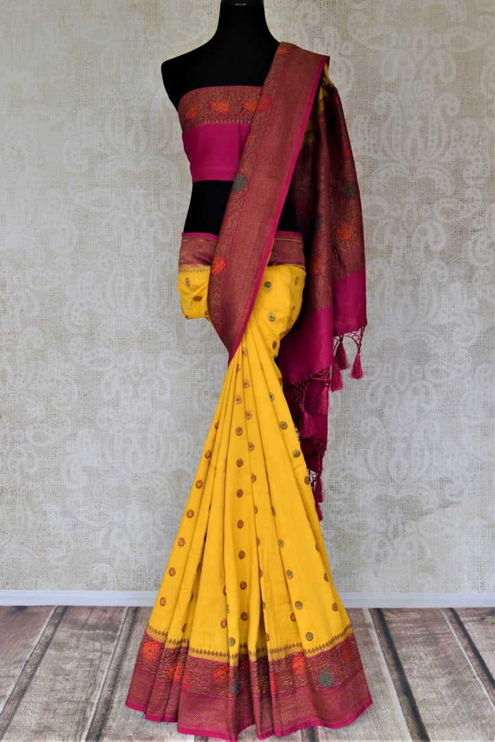 Buy yellow muga Benarasi saree online in USA with pink antique zari floral border. Keep your ethnic style updated with latest designer sarees, handloom sarees, muga silk sarees from Pure Elegance Indian fashion store in USA.-full view