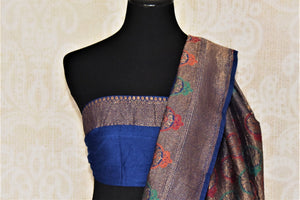 Buy beautiful blue muga Benarasi sari online in USA with dark blue antique zari floral border. Keep your ethnic style updated with latest designer sarees, handloom sarees, muga silk sarees from Pure Elegance Indian fashion store in USA.-blouse pallu