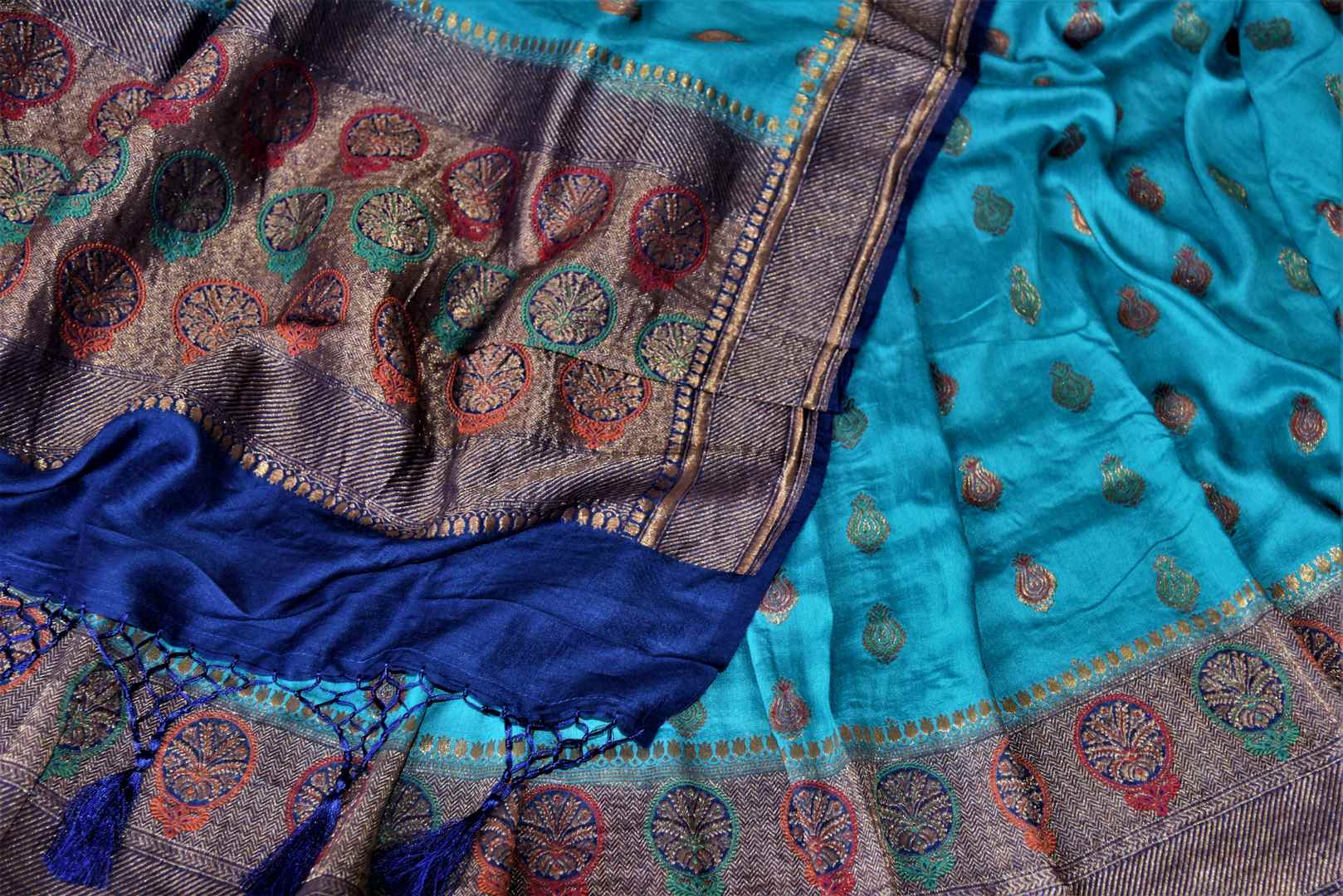 Buy beautiful blue muga Benarasi sari online in USA with dark blue antique zari floral border. Keep your ethnic style updated with latest designer sarees, handloom sarees, muga silk sarees from Pure Elegance Indian fashion store in USA.-details