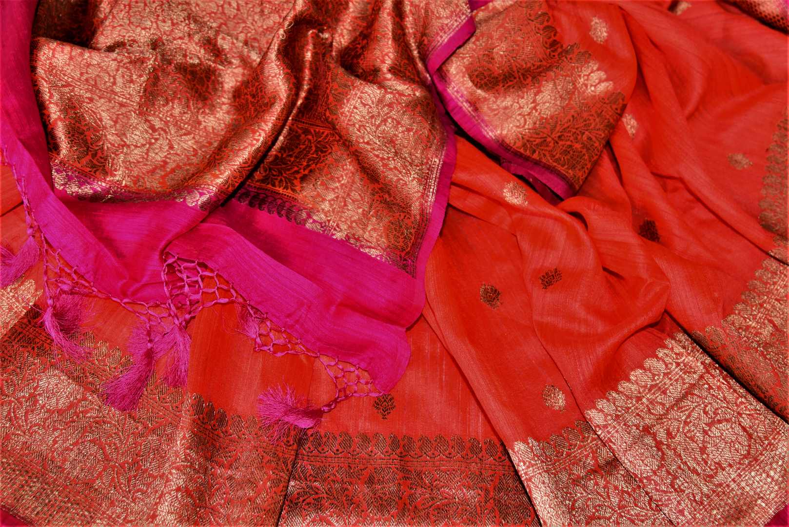 Buy bright red tussar Banarasi saree online in USA with zari buta and zari border. Choose tasteful handloom saris for special occasions from Pure Elegance. Our exclusive Indian fashion store has a myriad of exquisite pure silk saris, tussar sarees, Banarasi sarees for Indian women in USA.-details